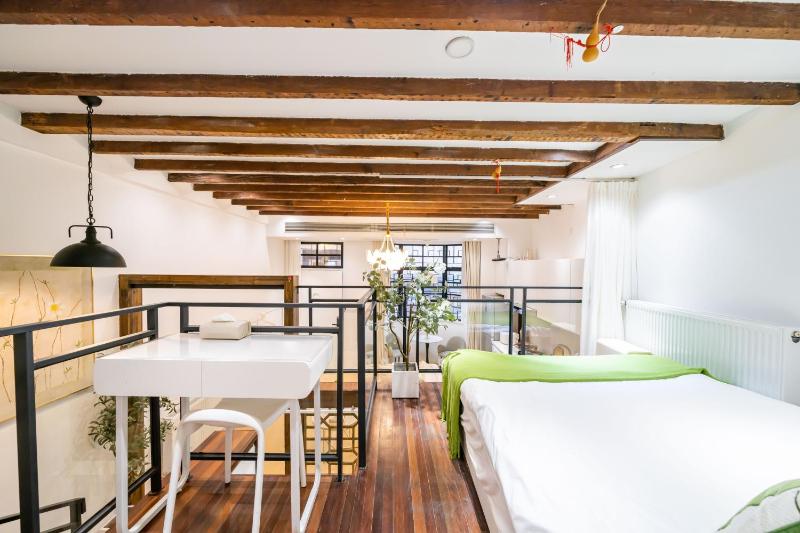ChaoYang - Bright Open-Plan Loft with Rustic Wooden Beams - image 3