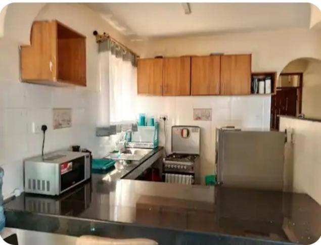 Modern Nyali 1BR with ACBalcony & SoundBar near Quickmart - image 3