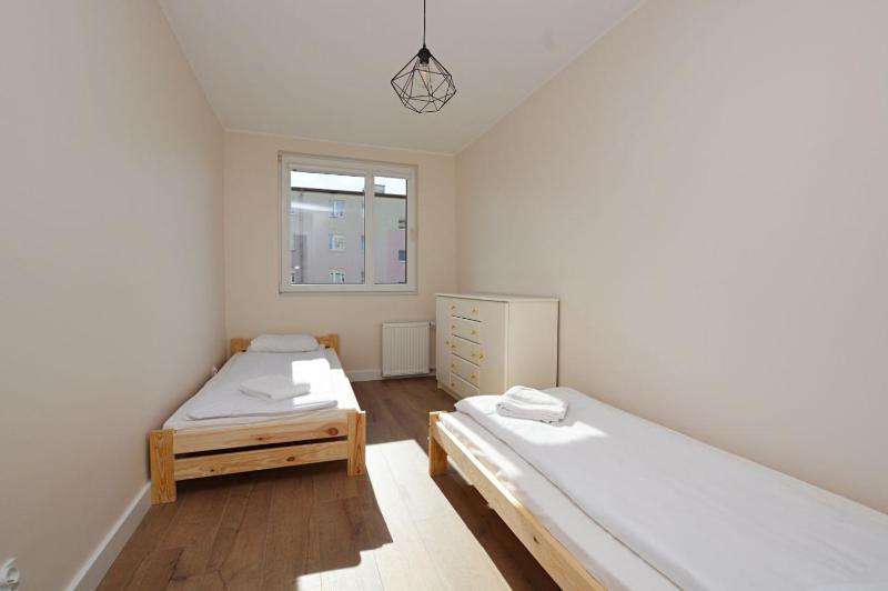 Spacious Victus Apartment with a Balcony Near the Beach by Noclegi Renters - image 6