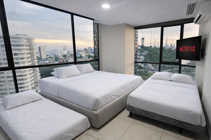 Apartamento moderno con vistas a la ciudad 2 dormitorios sala de estar y cocina equipada en la planta superior - image 8