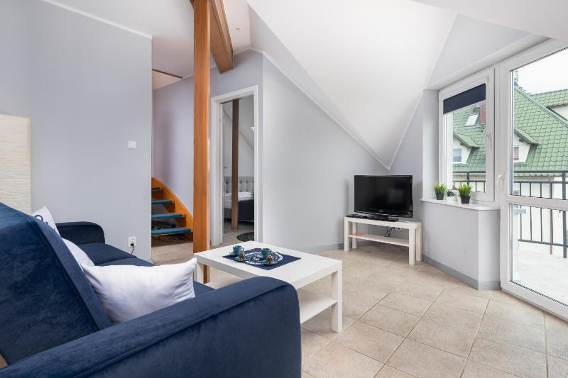 Przytulny Apartament Blisko Plaży by Noclegi Renters - image 10