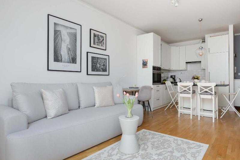 Modern Apartment with a Balcony in Warsaw by Noclegi Renters - image 13