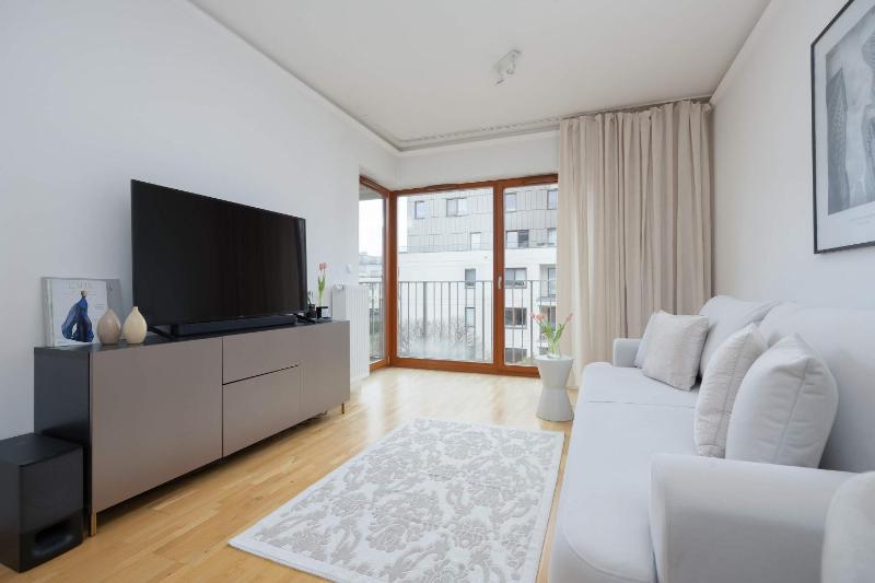 Modern Apartment with a Balcony in Warsaw by Noclegi Renters - image 11