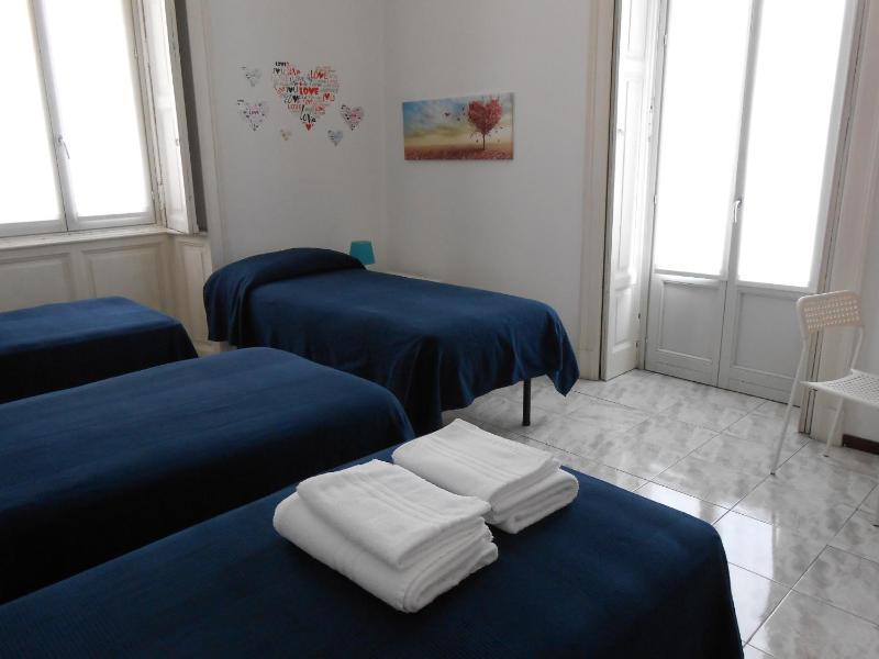 Economy Quadruple Room with Shared Bathroom image 1