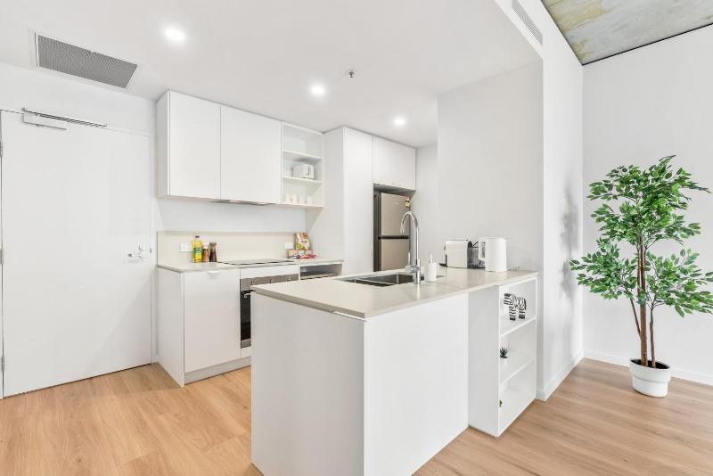 Stylish 2BR near Hospital with Gym Pool n Parking - image 12