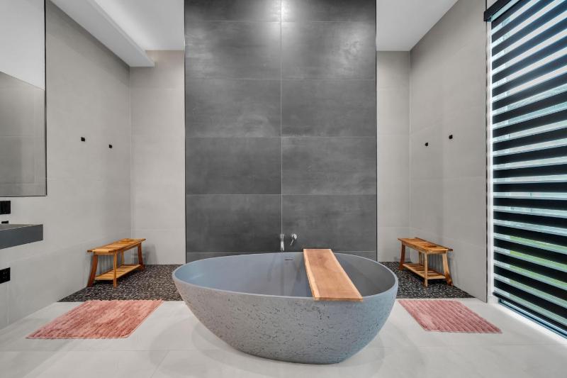 Modern Luxe Home - pool jacuzzi and channel view - image 36