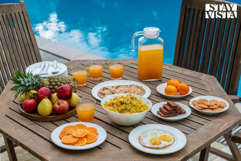 StayVista at La Rivieraa with Pool Lawn - image 10