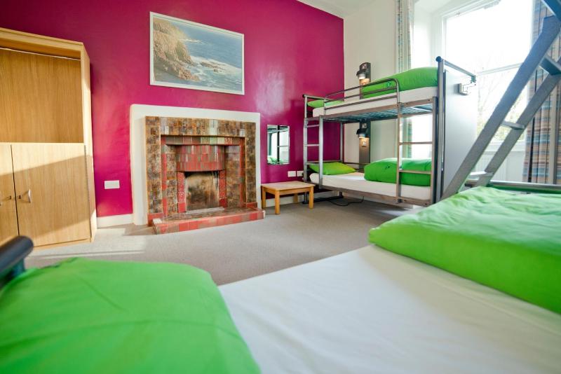 Bunk Bed in Male Dormitory Room with Shared Bathroom image 1