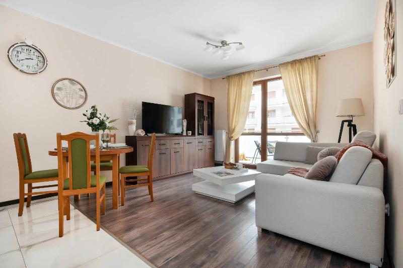 Spacious Apartment with a Balcony and Parking by Noclegi Renters - image 9