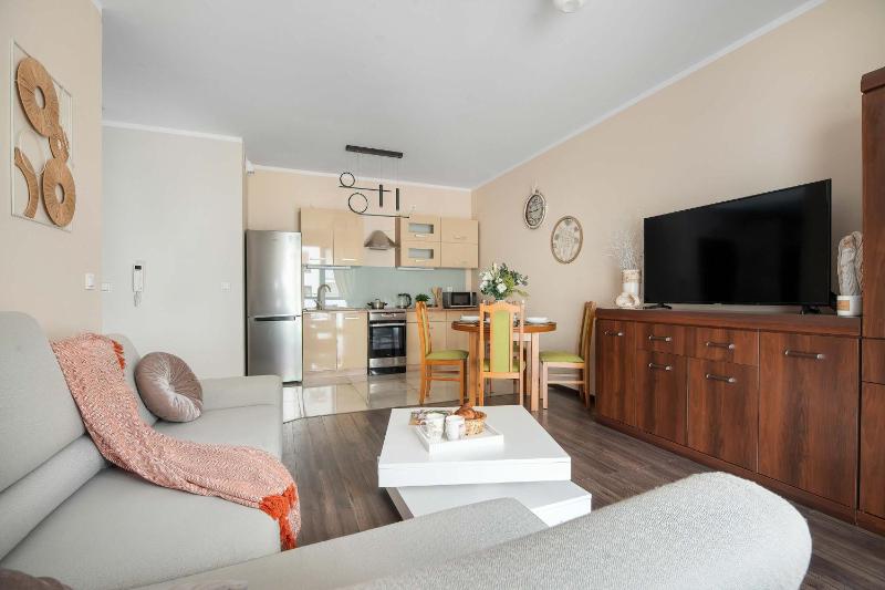 Spacious Apartment with a Balcony and Parking by Noclegi Renters - image 15
