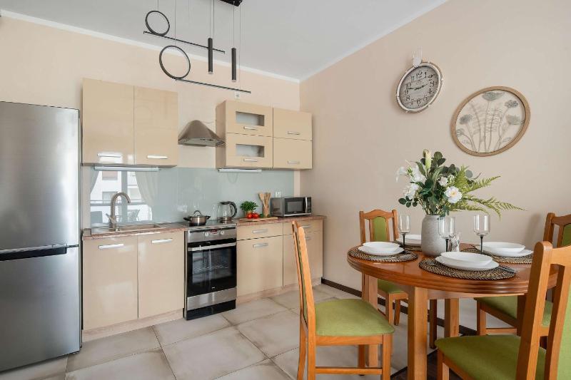 Spacious Apartment with a Balcony and Parking by Noclegi Renters - image 14
