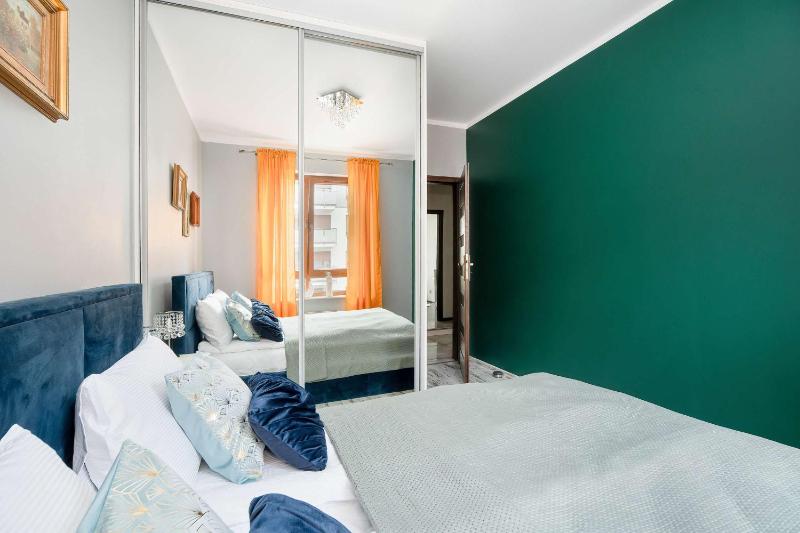 Spacious Apartment with a Balcony and Parking by Noclegi Renters - image 7
