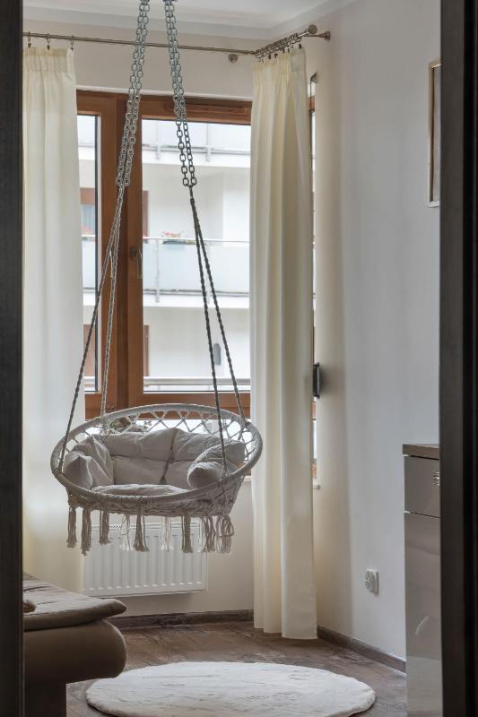 Spacious Apartment with a Balcony and Parking by Noclegi Renters - image 22