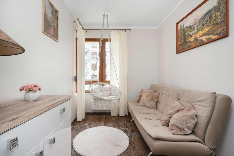 Spacious Apartment with a Balcony and Parking by Noclegi Renters - image 13