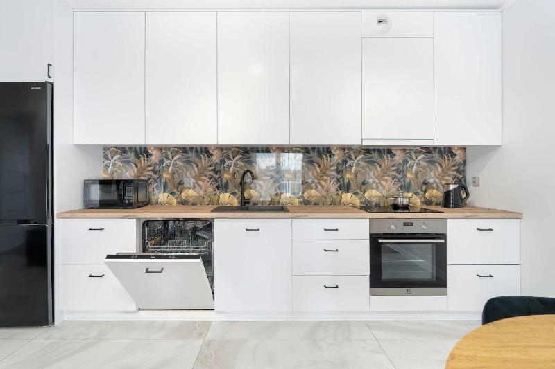 Spacious Family Apartment with a Balcony and Parking by Noclegi Renters - image 16