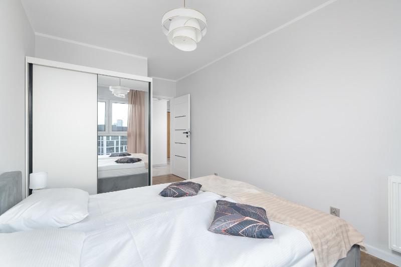 Spacious Family Apartment with a Balcony and Parking by Noclegi Renters - image 6