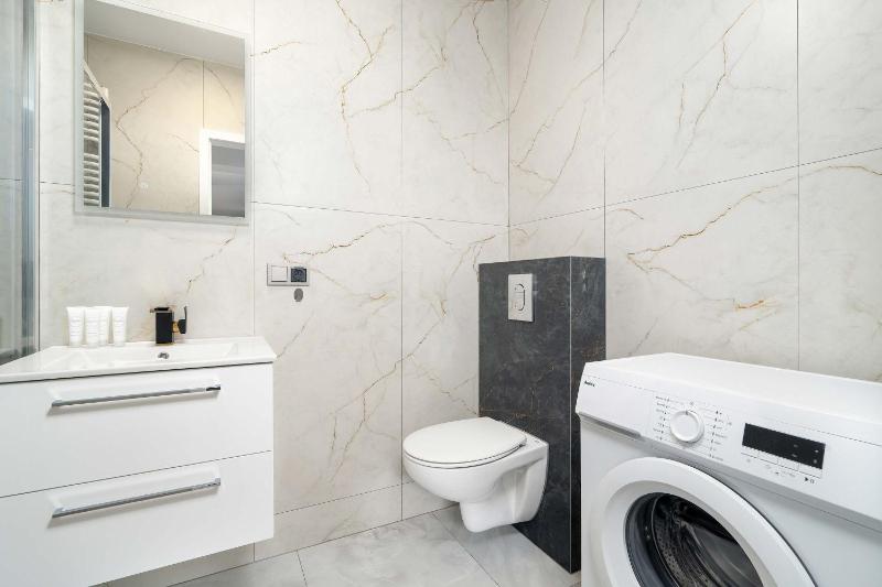 Spacious Family Apartment with a Balcony and Parking by Noclegi Renters - image 23