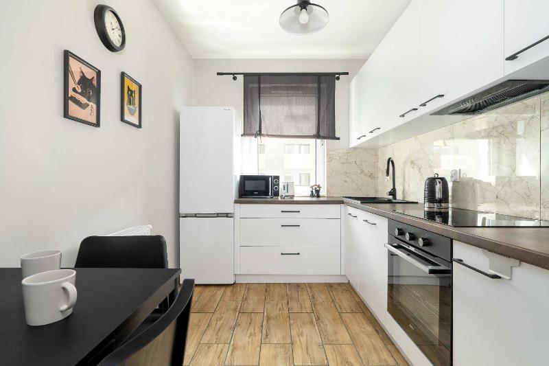 Unique Apartment with Balcony and Underground Parking by Noclegi Renters - image 6