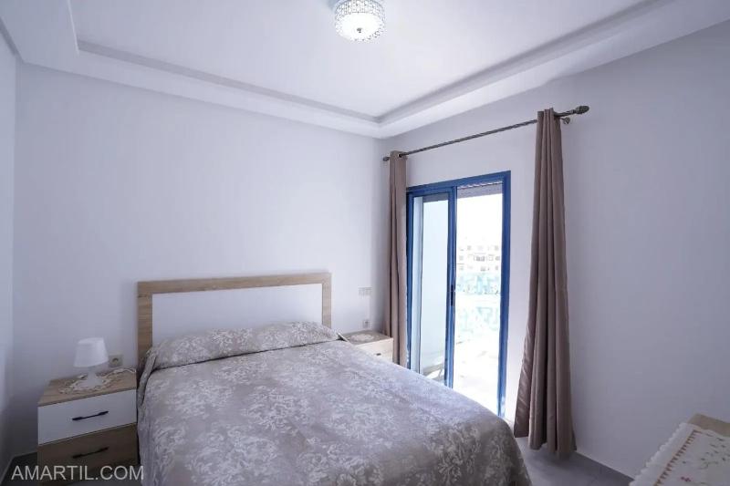 Charming 1-Bedroom Apartment in Martil with pool - image 7