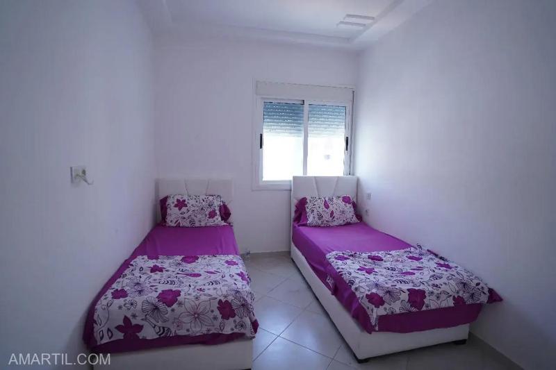 Charming 2-Bedroom Apartment with Garden View in Martil - image 22