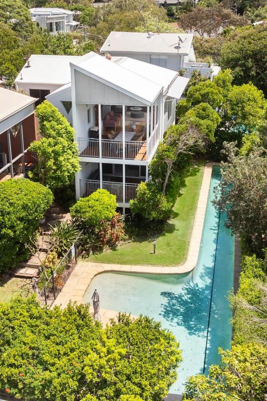 Tranquil Treetop Retreat with Pool and Ocean Views - image 1