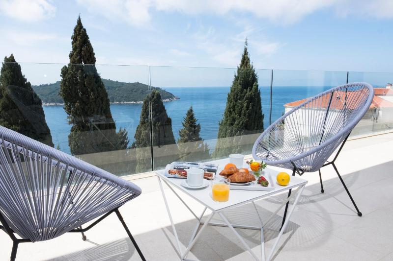 Private Entrance - Three-Bedroom Apartment with Balcony and Sea View image 3