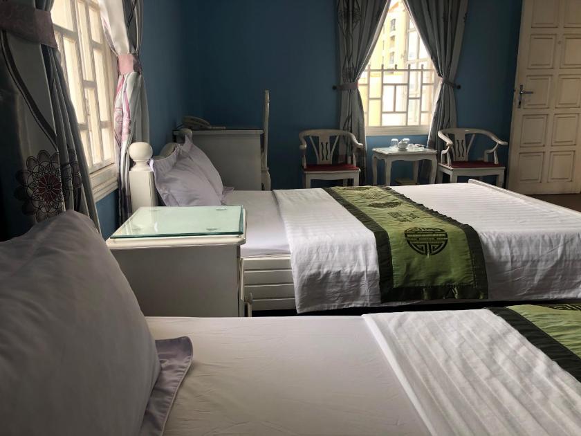 Phòng Giường đôi Deluxe (2 Người lớn + 1 Trẻ em) Phòng Giường đôi Deluxe (2 Người lớn + 1 Trẻ em)