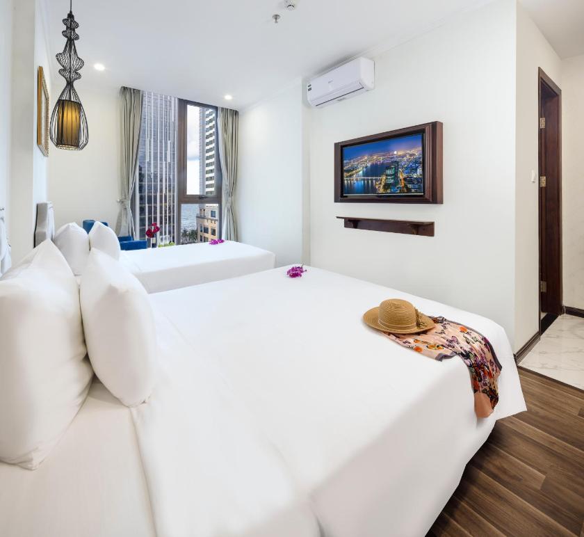 Phòng Deluxe 2 Giường Đơn Nhìn ra Một góc Biển Phòng Deluxe 2 Giường Đơn Nhìn ra Một góc Biển