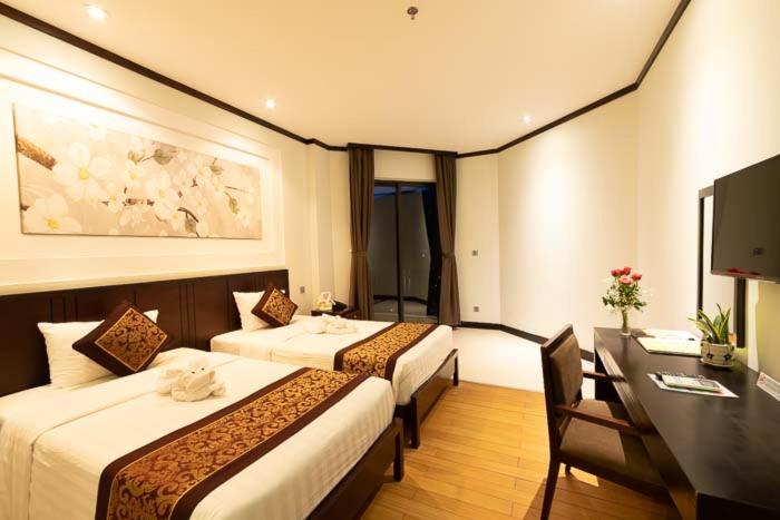 Phòng Deluxe nằm ở góc với 2 Giường đơn Nhìn ra biển