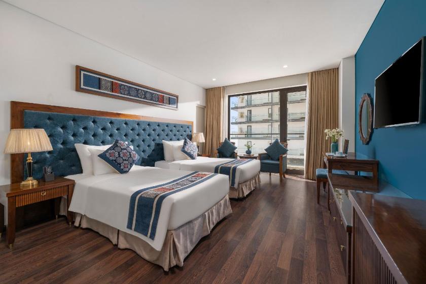 Phòng Deluxe 2 Giường Đơn Có Ban Công Và Tầm Nhìn Ra Một Góc Biển Phòng Deluxe 2 Giường Đơn Có Ban Công Và Tầm Nhìn Ra Một Góc Biển