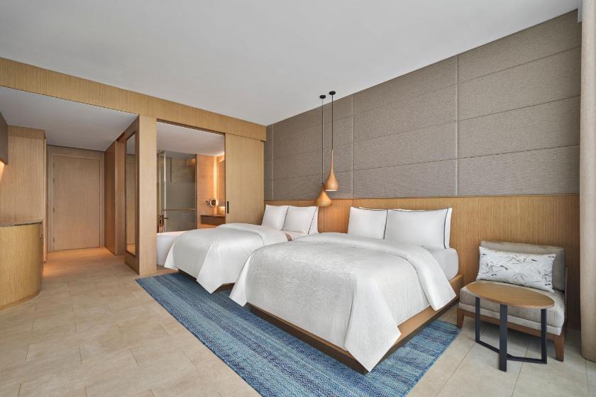 Deluxe Sea View with Two Double Beds and Balcony