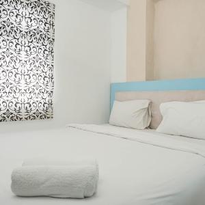 Gorgeous 2BR Green Pramuka Apartment By Travelio