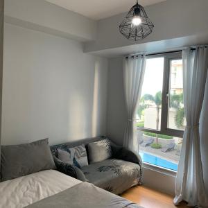 Minimalist 1 Bedroom in Alabang near Molito and ATC with WiFi & Netflix m