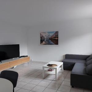 Charmant appartement au rez de jardin d'une maison