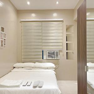 Condo along Tomas Morato w/ WiFi SmartTV & Karaoke