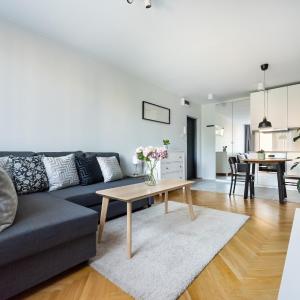 Nowogrodzka Grey Apartment by BookingHost