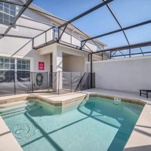 In the heart of Kissimmee Storey Lake Resort 4BD 3BA Pool Townhome 4SL4857