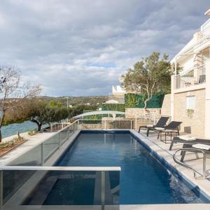 Villa Sea Touch - beachfront, with a heated pool