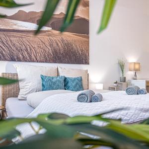 Gemütliche Ferienwohnung mit 2 Schlafzimmern, kostenfreiem Parkplatz, modernem Bad, Küche, Waschmaschine & Trockner