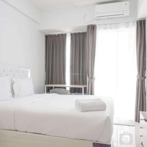 Modern Look Studio Room at Citra Living Apartment By Travelio
