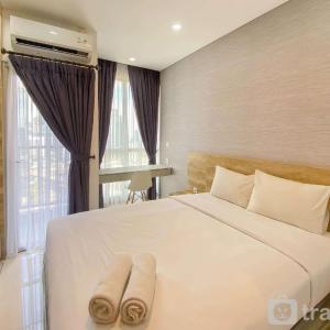 Restful and Comfortable Studio at Ciputra World 2 Apartment By Travelio
