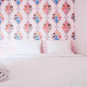 Homey and Fresh 2BR Green Pramuka Apartment By Travelio