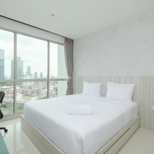 Cozy Living and Tidy 2BR Ciputra World 2 Apartment By Travelio