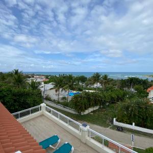 2 BR & 1WR Suite at Villa Costa Verde near Playa Cofresi, Puerto Plata with a pool, balcony, and a rooftop terrace