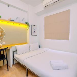 Great Choice and Cozy 2BR at Green Pramuka City Apartment By Travelio
