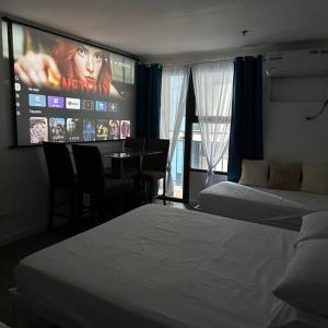 Studio w projector Wifi Netflix and pool access in ADB Tower Ortigas CBD