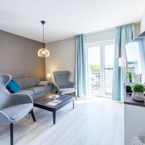 Boddenperle - 5-Sterne-Ferienwohnung mit Ostbalkon, 2 Bädern & Strandhaus-Charme