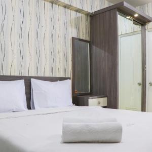 Cozy and Enjoy Studio Room at Green Pramuka City Apartment By Travelio