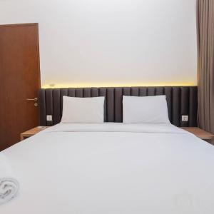 Minimalist and Homey 1BR at Ciputra World 2 Apartment By Travelio