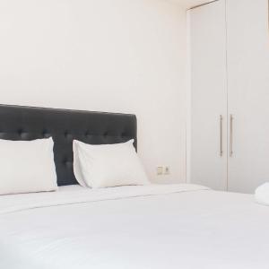 Fully Furnished with Cozy Design 2BR The Bellezza Apartment By Travelio